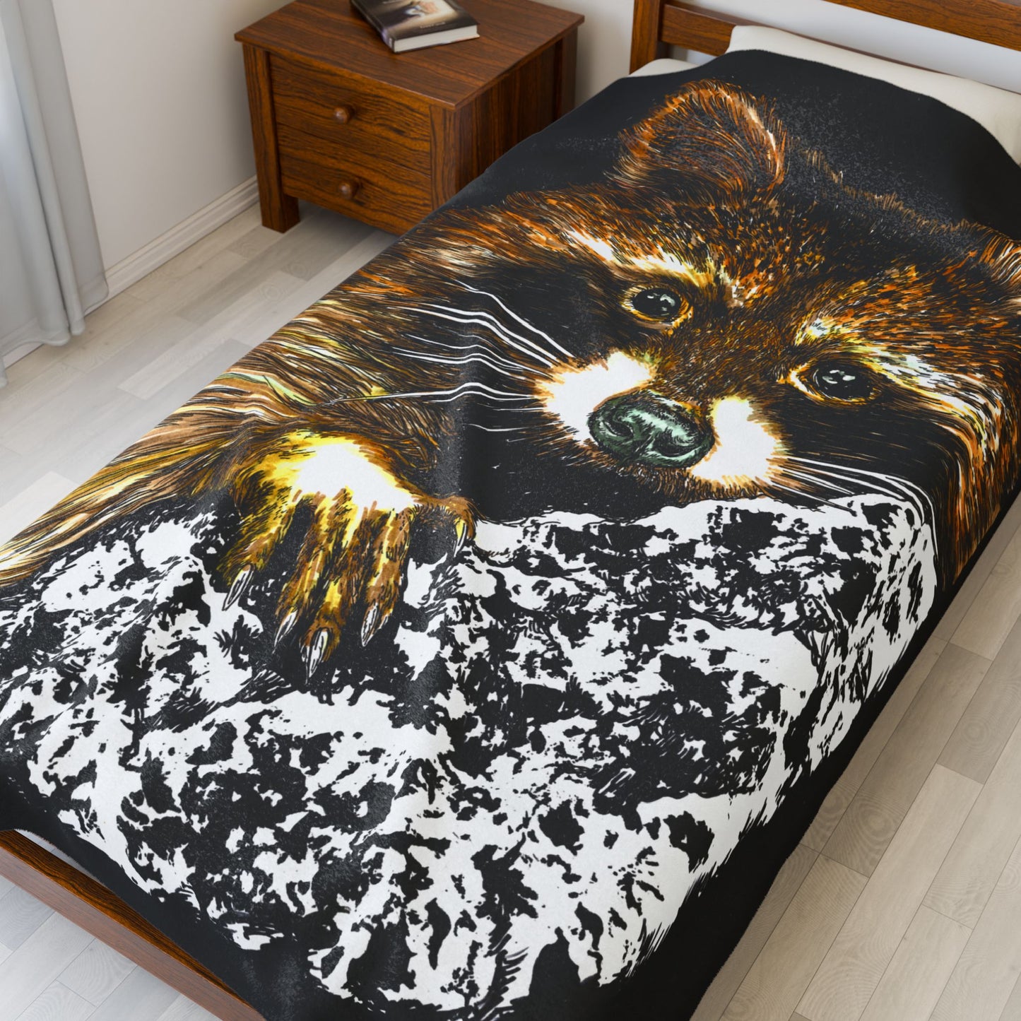 Raccoon illustration on black background, featured on a plush blanket designed for animal lovers.