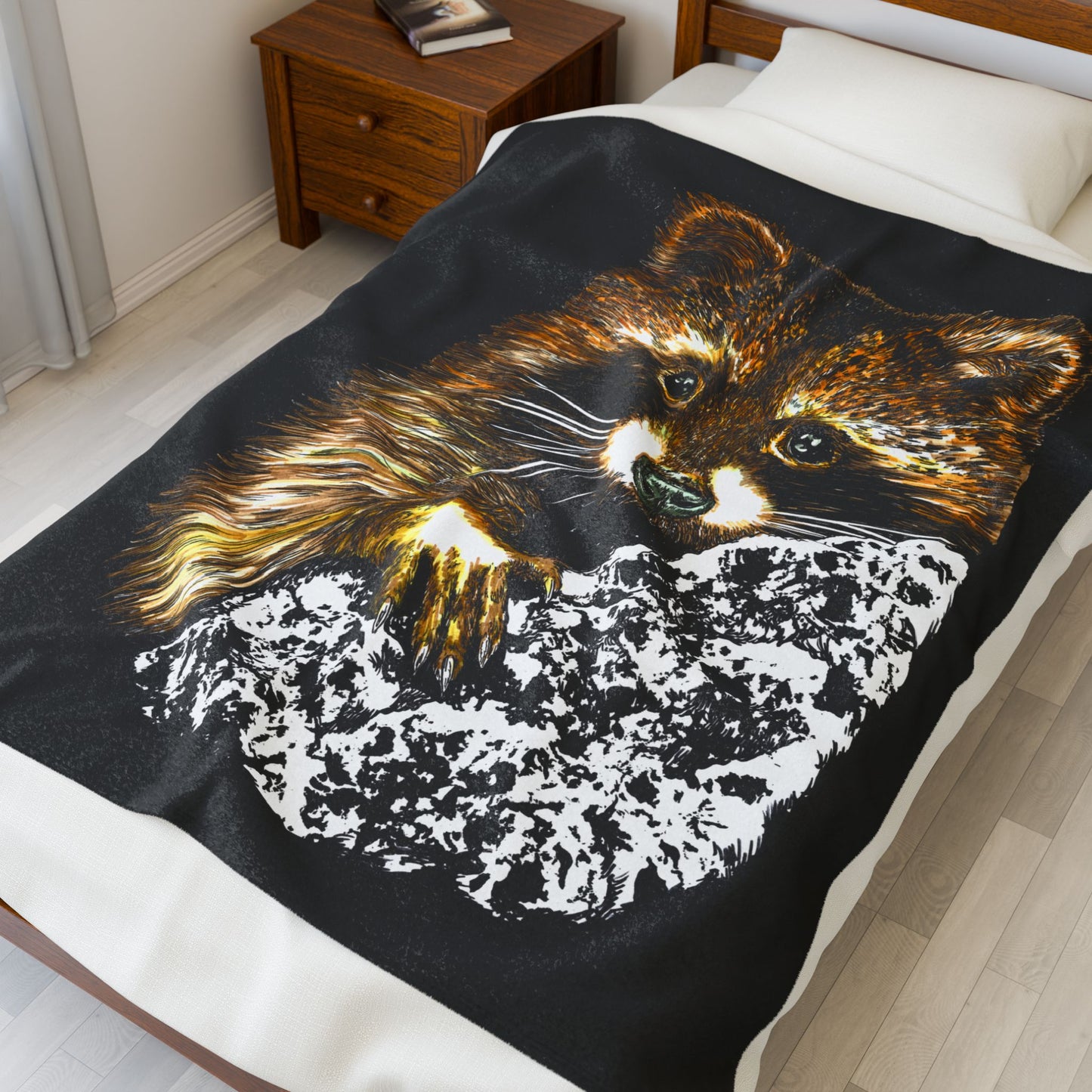 Raccoon illustration on black background, featured on a plush blanket designed for animal lovers.