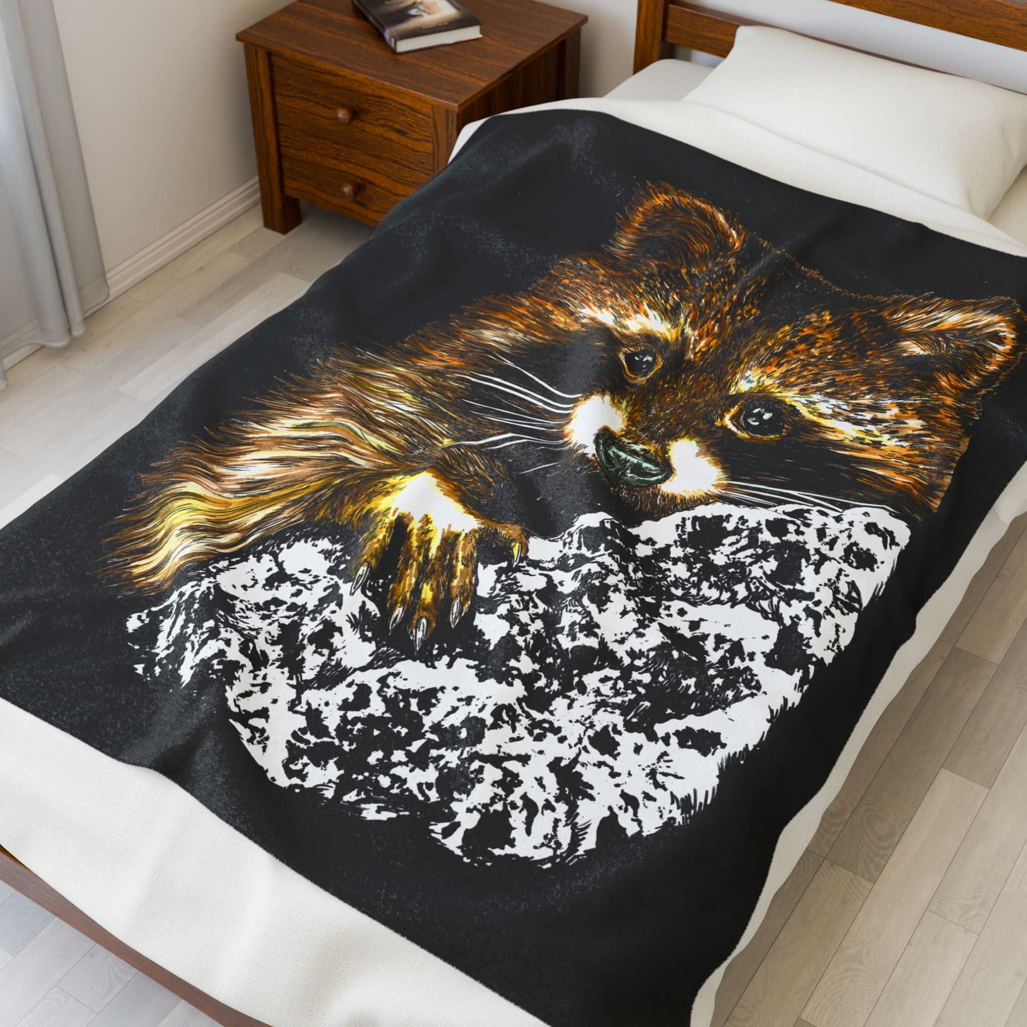 Raccoon illustration on black background, featured on a plush blanket designed for animal lovers.